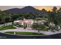 Luxury home with pool, mountain views, and landscaped grounds at 6301 E Huntress Dr, Paradise Valley, AZ 85253