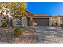 Single-story home with stone accents and a two-car garage at 28965 N 120Th Dr, Peoria, AZ 85383
