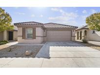 One-story house with attached garage and desert landscaping at 40925 W Patricia Ln, Maricopa, AZ 85138