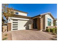 Modern home with attractive curb appeal and landscaped front yard at 5273 N 207Th Dr, Buckeye, AZ 85396
