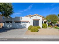 Single-story home with two-car garage and landscaped front yard at 1480 E Harrison St, Gilbert, AZ 85295