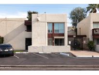 Front view of a two-story building with parking at 3828 N 32Nd St # 104, Phoenix, AZ 85018