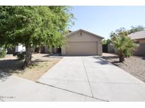 Single-story house with a two-car garage and a tree-lined driveway at 6709 W Luke Ave, Glendale, AZ 85303