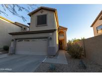 Two-story house with attached garage and desert landscaping at 333 E Redwood Ln, Phoenix, AZ 85048