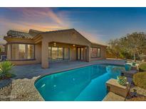 Expansive backyard oasis featuring a large pool and patio at 18088 W Narramore Rd, Goodyear, AZ 85338