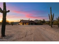 Ranch-style home with a long driveway and desert landscape at 34642 N 52Nd St, Cave Creek, AZ 85331