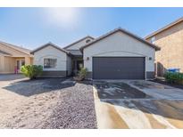 Single-story home with a two-car garage and desert landscaping at 7913 W Chickasaw St, Phoenix, AZ 85043