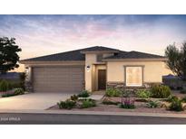 One-story home with desert landscaping, attached garage, and neutral color palette at 17867 W Encinas Ln, Goodyear, AZ 85338