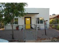 Cute bungalow with yellow door, fenced yard, and mature tree at 418 N Sirrine --, Mesa, AZ 85201