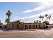 Single-story home with desert landscaping and palm trees at 10801 N 45Th St, Phoenix, AZ 85028