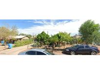 Ranch style home with mature landscaping and a paved driveway at 113 N 30Th N Ave, Phoenix, AZ 85009