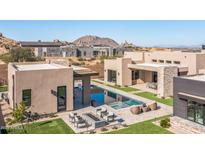Modern home with a large pool and expansive backyard at 12659 E Shadow Ridge Dr, Scottsdale, AZ 85255
