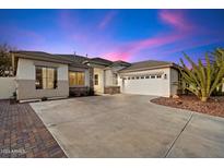 Single-story home with a two-car garage and desert landscaping at 6624 S Wilson Dr, Chandler, AZ 85249