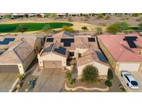 Aerial view of a single-story house with solar panels and a landscaped yard at 26822 W Oraibi Dr, Buckeye, AZ 85396