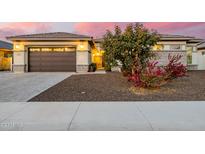 Beautiful home with a 2-car garage, landscaping, and a paved driveway at 3538 E Hazeltine Way, Queen Creek, AZ 85142