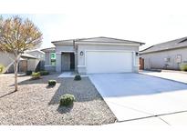 Single-story home with attached garage and desert landscaping at 18157 W Foothill Dr, Surprise, AZ 85387
