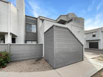 Exterior view of condo building, showing building and storage area at 9439 N 59Th Ave # 241, Glendale, AZ 85302