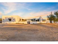 Exterior view of a beautiful home with stucco walls and a metal roof at 29441 N 64Th St, Cave Creek, AZ 85331