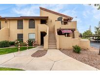 Spanish style condo building with stairs leading to entrance and landscaping at 1351 N Pleasant Dr # 2001, Chandler, AZ 85225