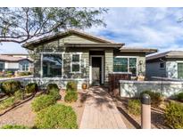 Single-story home with landscaped walkway and neutral exterior at 20771 W Windsor Blvd, Buckeye, AZ 85396