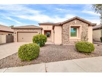 Single-story home with stone accents and landscaped front yard at 3016 E Maplewood St, Gilbert, AZ 85297