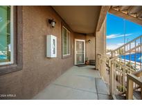 Exterior view of condo building showcasing entrance and landscaping at 10136 E Southern Ave # 2089, Mesa, AZ 85209