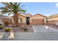 Single-story home with a desert landscaping and two-car garage at 18075 W Browning Dr, Surprise, AZ 85374