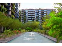 Upscale condo community with a tranquil water feature and lush landscaping at 7120 E Kierland Blvd # 520, Scottsdale, AZ 85254