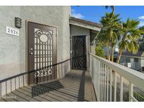 Building exterior showing entrance with security door and gated balcony at 19601 N 7Th St # 2026, Phoenix, AZ 85024