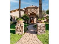 Inviting front entrance with stone accents and a landscaped walkway at 4528 E Hobart St, Mesa, AZ 85205