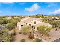 Two-story house with a landscaped yard and mountain views at 7150 E Morning Vista Ln, Scottsdale, AZ 85266