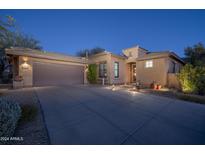 Attractive single-story home with a two-car garage and well-manicured landscaping at 11233 E Butherus Dr, Scottsdale, AZ 85255