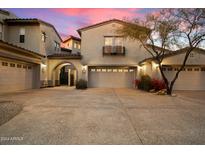 Two story home with attached two car garage, private courtyard, and beautiful landscaping at 20802 N Grayhawk Dr # 1087, Scottsdale, AZ 85255