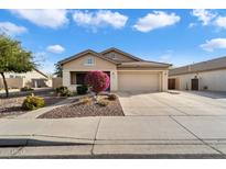 Single-story house with attached garage and landscaped front yard at 21995 N 76Th Ln, Peoria, AZ 85383