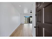 Bright living room with hardwood floors and sliding glass door at 2415 N 71St St # D, Scottsdale, AZ 85257