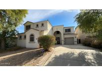 Two-story house with a large driveway and landscaped front yard at 1167 W Dana Dr, San Tan Valley, AZ 85143