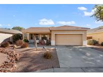 Single-story house with a two-car garage and desert landscaping at 17221 N Thornberry Dr, Surprise, AZ 85374