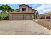 Two-story house with a two-car garage and landscaped yard at 340 W Locust Dr, Chandler, AZ 85248