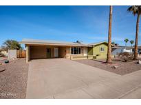 Ranch style home with carport and landscaped yard at 5914 E Decatur St, Mesa, AZ 85205