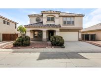 Two-story house with a landscaped front yard and attached two-car garage at 533 W Prickly Pear Dr, Casa Grande, AZ 85122