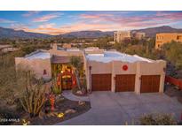 Three-car garage, landscaped yard, and beautiful Southwestern architecture at 5640 E Miramonte Dr, Cave Creek, AZ 85331