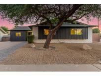 Updated mid-century modern home with a charming front yard at 8601 E Roanoke Ave, Scottsdale, AZ 85257