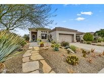 Single-story home with desert landscaping and a large garage at 11526 E Diamond Cholla Dr, Scottsdale, AZ 85255