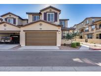 Two-story townhome with attached garage and landscaping at 1255 N Arizona Ave # 1276, Chandler, AZ 85225