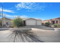 Single-story home with a two-car garage and landscaped front yard at 1793 N Westfall Ln, Casa Grande, AZ 85122