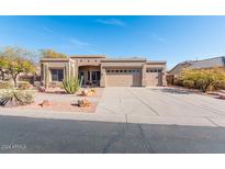 Single-story home with desert landscaping and three-car garage at 2443 N Trenton --, Mesa, AZ 85207