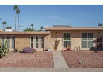 Attractive single-level home with a well-maintained front yard at 9912 W Cedar Dr, Sun City, AZ 85351