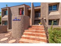 Condo building exterior with stairs and landscaping at 7000 N Via Camello Del Sur -- # 37, Scottsdale, AZ 85258