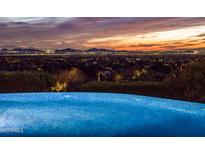 Stunning infinity pool overlooking city lights at sunset at 10040 E Happy Valley Rd # 512, Scottsdale, AZ 85255