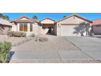 Single-story house with a two-car garage and desert landscaping at 2394 E Fiesta Dr, Casa Grande, AZ 85194